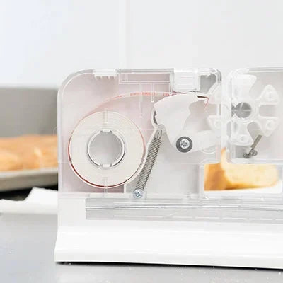 Plastic bag sealer machine with resealable tape dispenser for sealing plastic bags